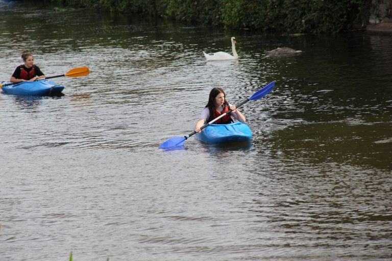 Kayaking with a swan